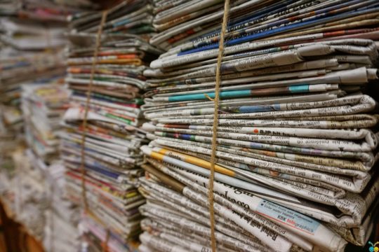 Stacked and Bundled Newspapers